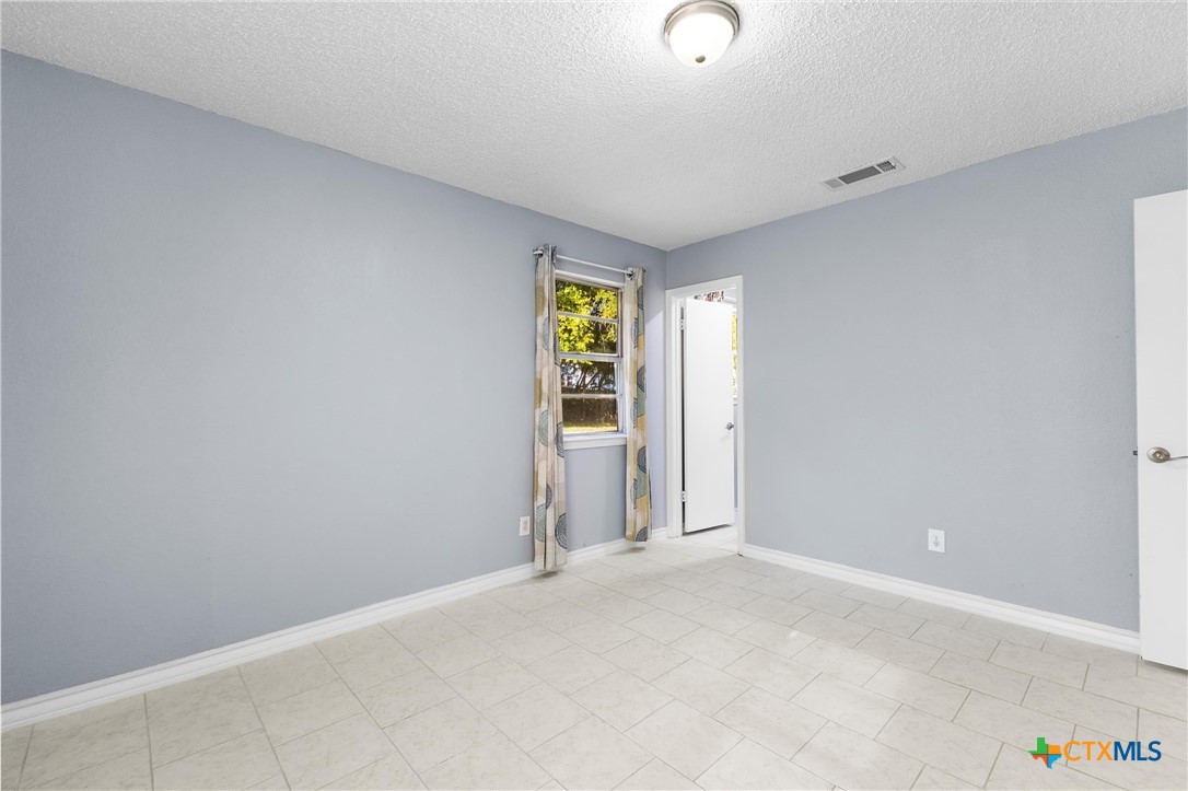 104 East Arlo Road Harker Heights, TX 76548 - Photo 24 of 35 a view of an empty room with window and closet area