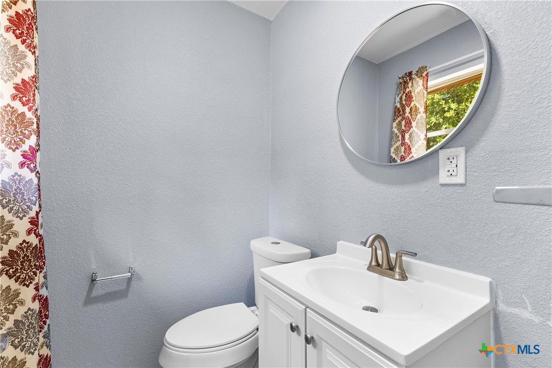 104 East Arlo Road Harker Heights, TX 76548 - Photo 27 of 35 a bathroom with a sink and a mirror