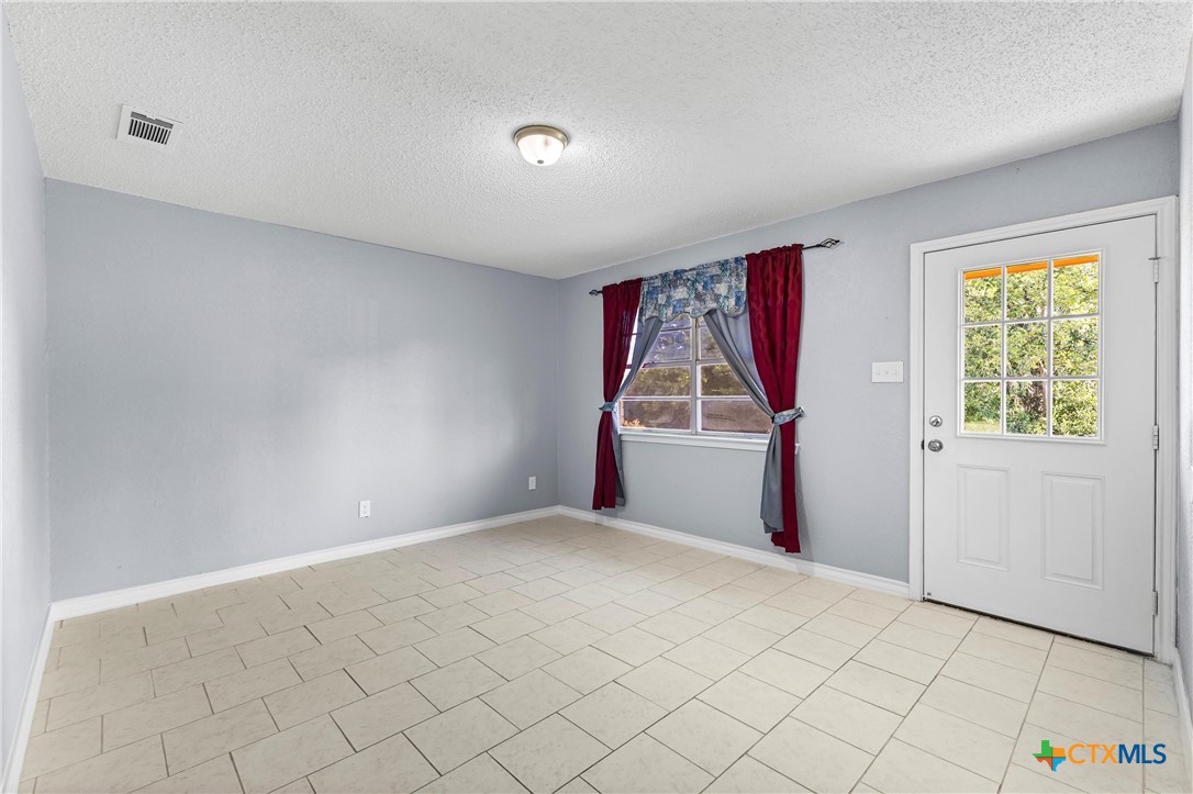 104 East Arlo Road Harker Heights, TX 76548 - Photo 4 of 35 a view of a room with wooden floor and window