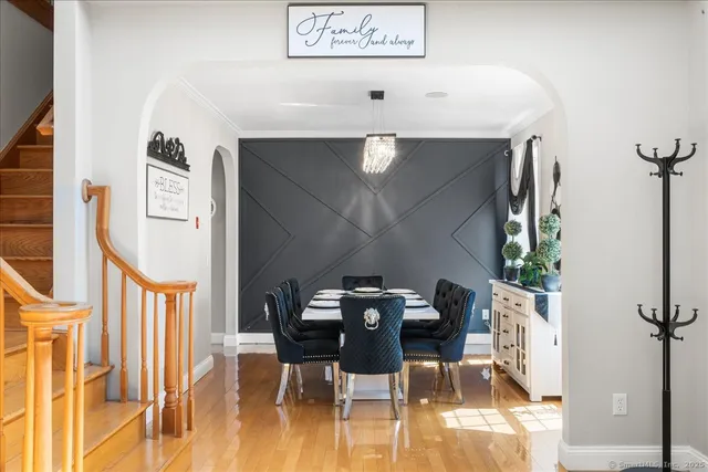 a view of a dinning room with furniture and wooden floor