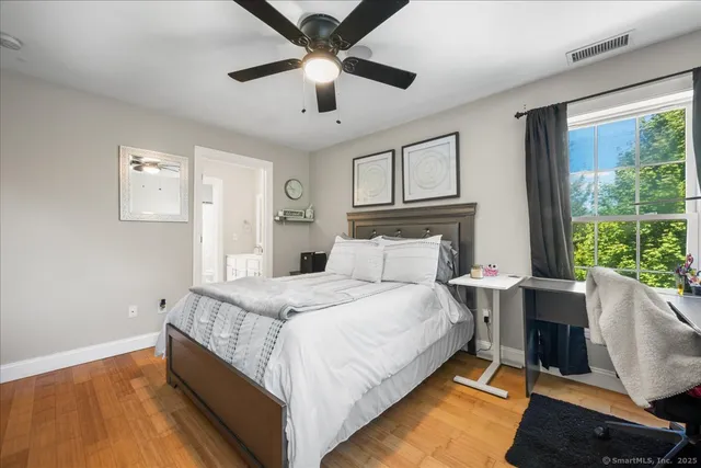 a bed room with a bed and a window