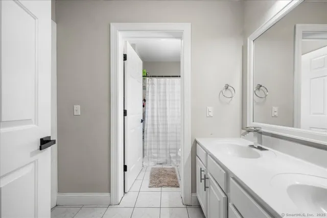 a bathroom with a sink a vanity and a mirror