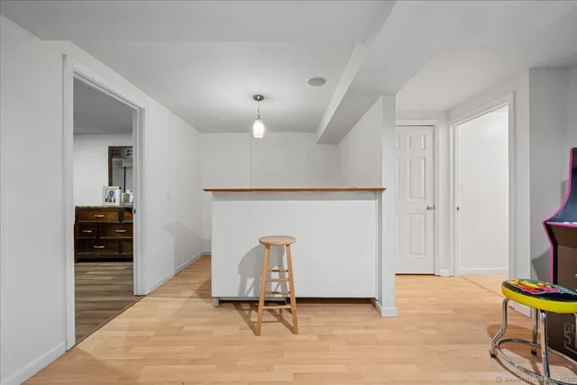 a living room with furniture and a chair