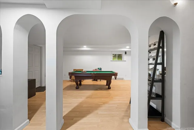 a view of entryway with stairs and wooden floor