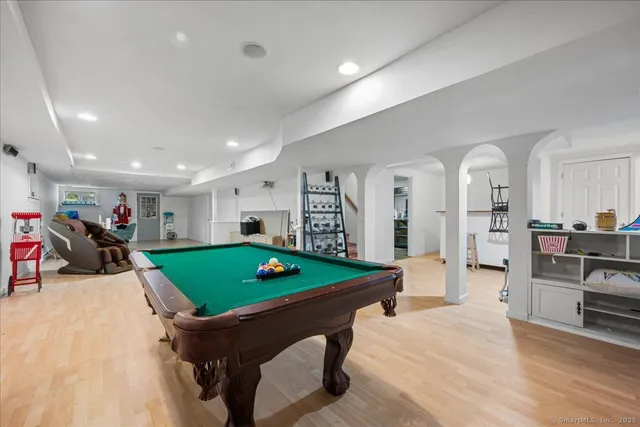 a room with furniture and view of kitchen