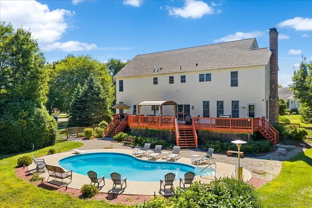 a view of a swimming pool with a patio