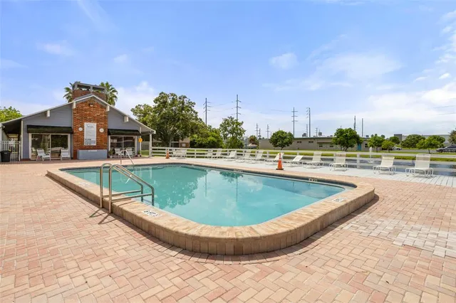 a view of a swimming pool with a terrace