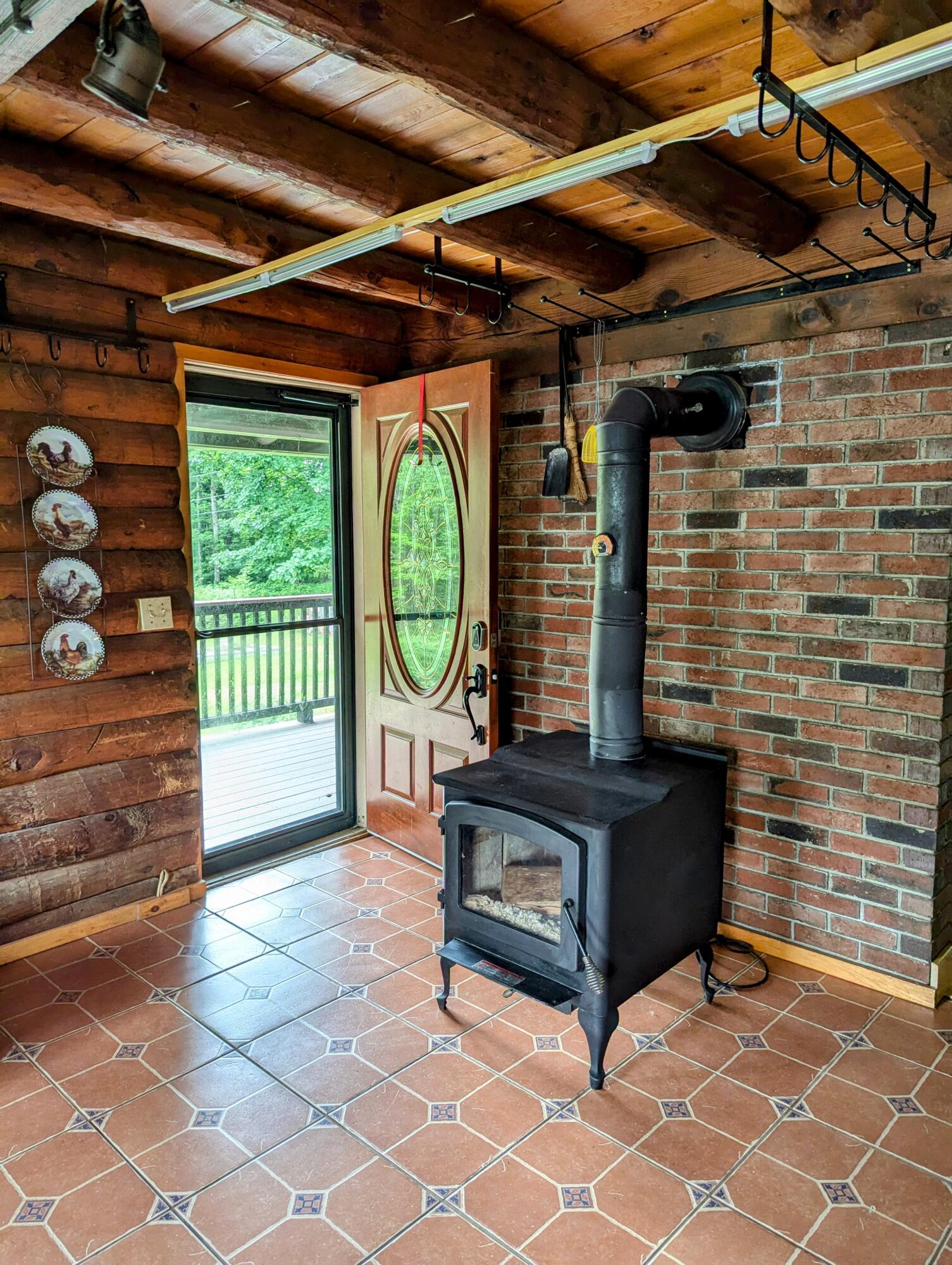 294 Spring Road Pittsfield, ME 04967 - Photo 13 of 48 Door to front porch/woodstove