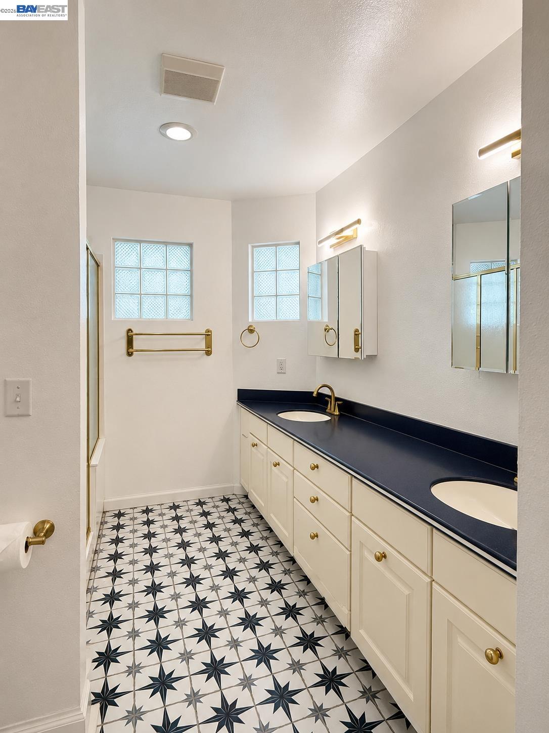 2516 Dos Rios Drive San Ramon, CA 94583 - Photo 10 of 14 a bathroom with a sink a vanity and a mirror