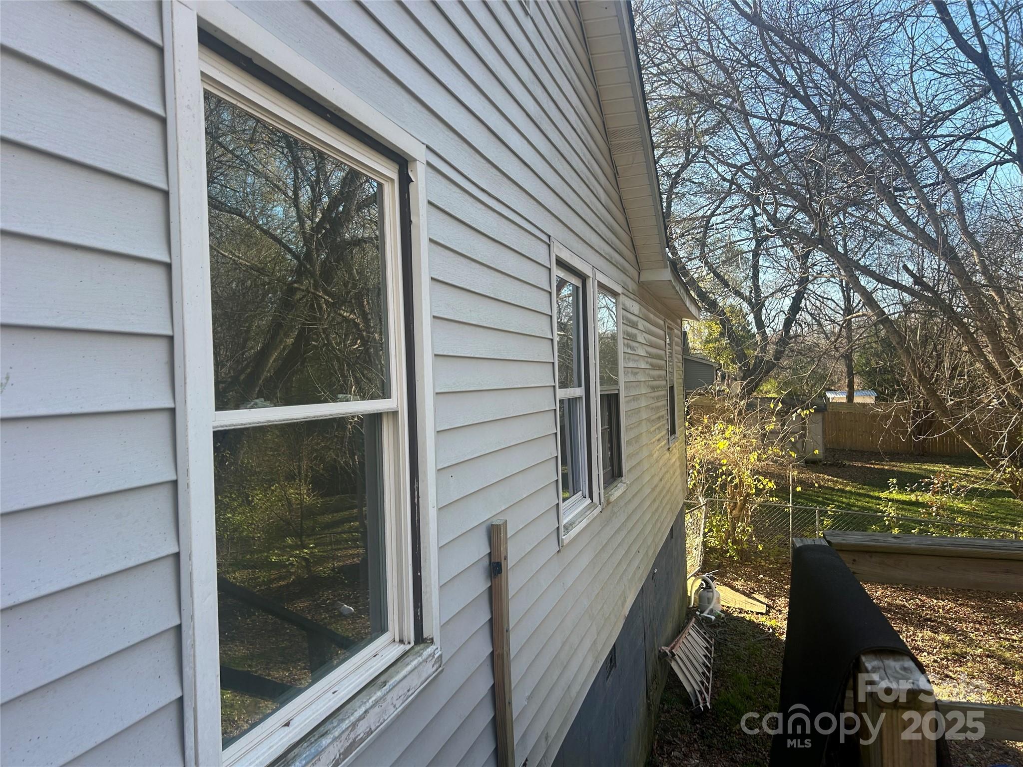 306 Valley Street Stanley, NC 28164 - Photo 18 of 19 a view of a balcony with a door and wooden floor