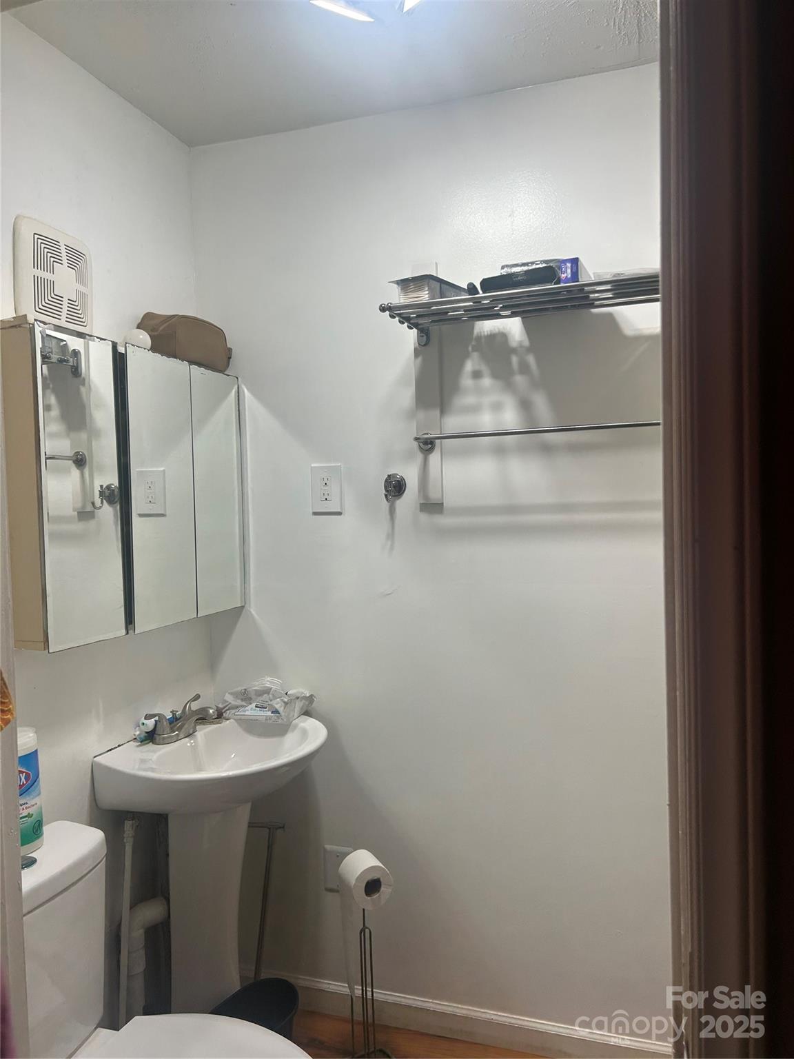 306 Valley Street Stanley, NC 28164 - Photo 7 of 19 a bathroom with a sink a toilet and mirror