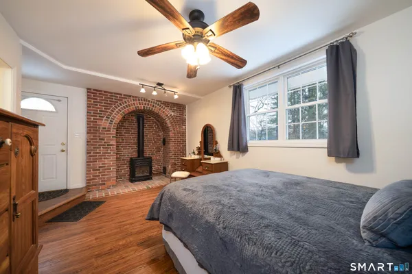 a view of a livingroom with furniture and hardwood floor