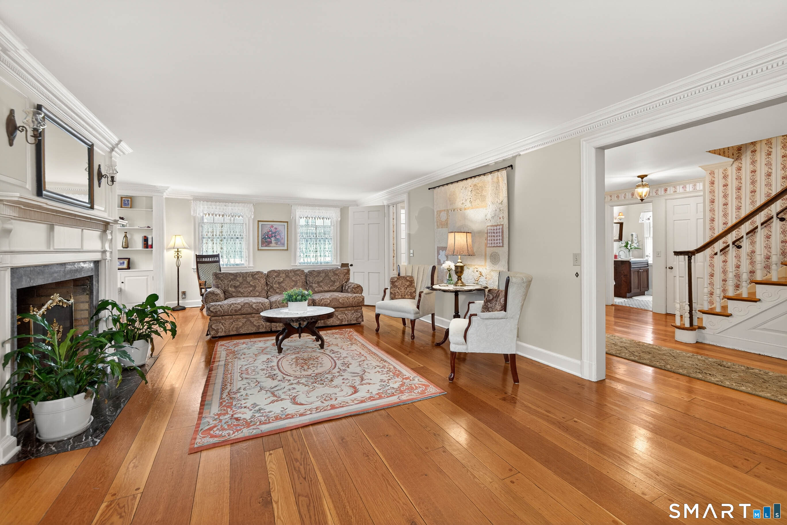 85 Cherry Hill Road Branford, CT 06405 - Photo 17 of 40 a living room with furniture and a fireplace