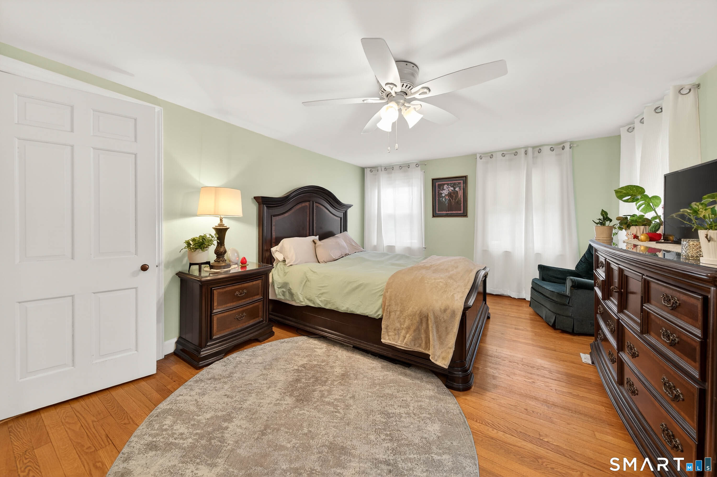 85 Cherry Hill Road Branford, CT 06405 - Photo 36 of 40 a bedroom with a bed and a chandelier