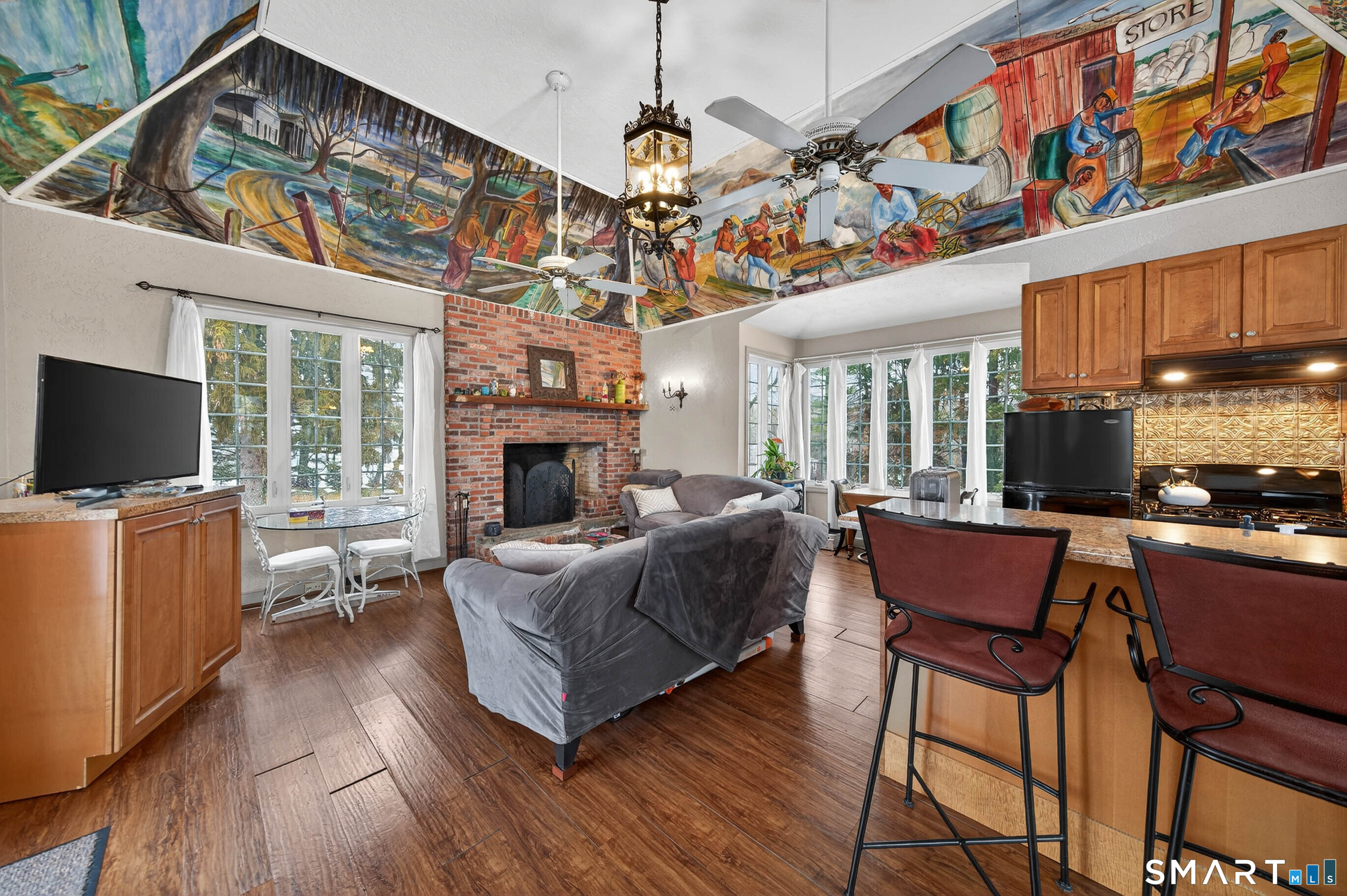 85 Cherry Hill Road Branford, CT 06405 - Photo 7 of 40 a living room with furniture a flat screen tv and a fireplace