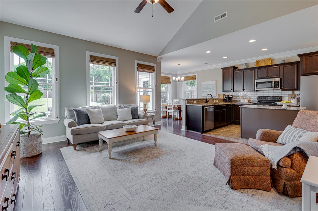 203 Streams Way Anderson, SC 29625 - Photo 15 of 47 This inviting space combines living, dining, and kitchen areas for seamless everyday living.