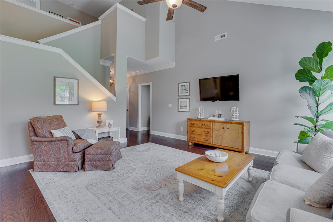 203 Streams Way Anderson, SC 29625 - Photo 17 of 47 This bright living space features soaring ceilings and elegant wood flooring.