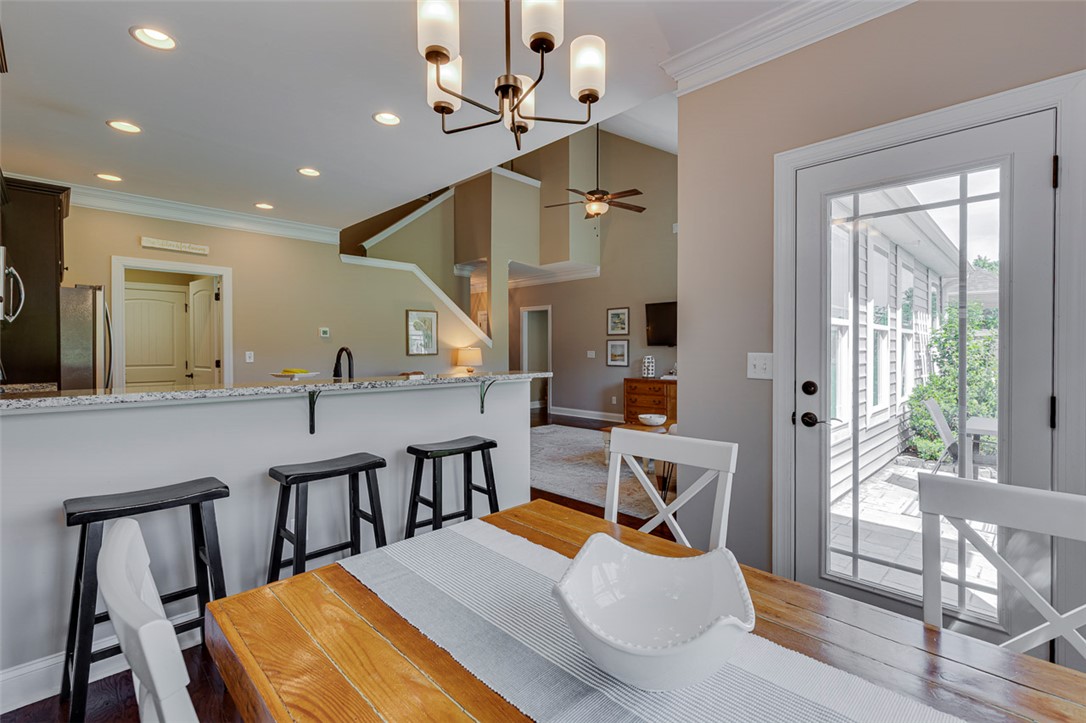 203 Streams Way Anderson, SC 29625 - Photo 26 of 47 This inviting dining area seamlessly connects to the kitchen, creating an ideal space for entertaining.