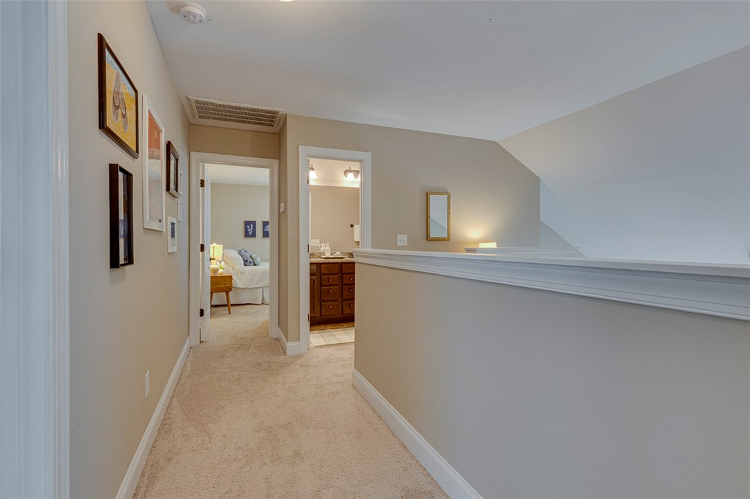 203 Streams Way Anderson, SC 29625 - Photo 31 of 47 This interior hallway connects to a comfortable bedroom and a well-appointed bathroom.