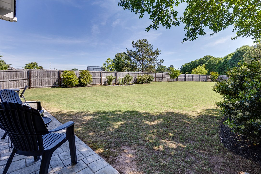 203 Streams Way Anderson, SC 29625 - Photo 39 of 47 Expansive green space offers a serene private yard, perfect for outdoor leisure and entertaining.