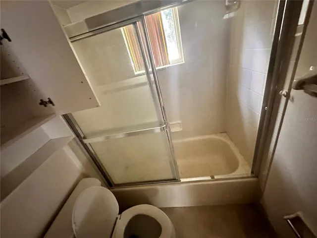 a view of walk in closet with window