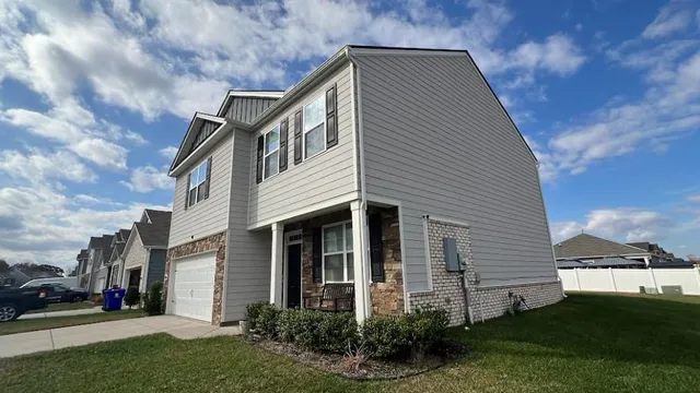 a front view of a house with a yard