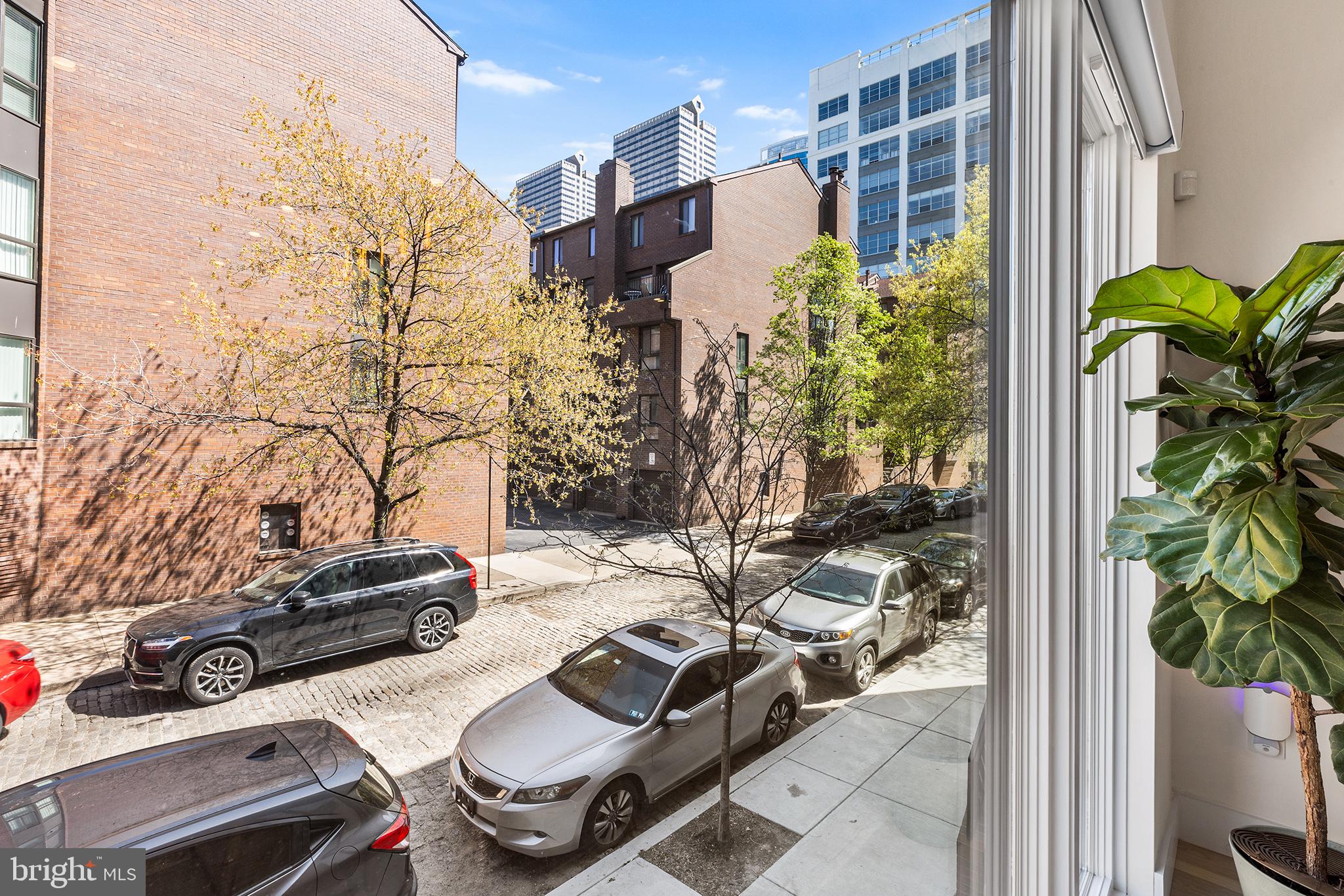 116 North Croskey Street Philadelphia, PA 19103 - Photo 11 of 57 a view of backyard with wheel chair potted plants and large tree