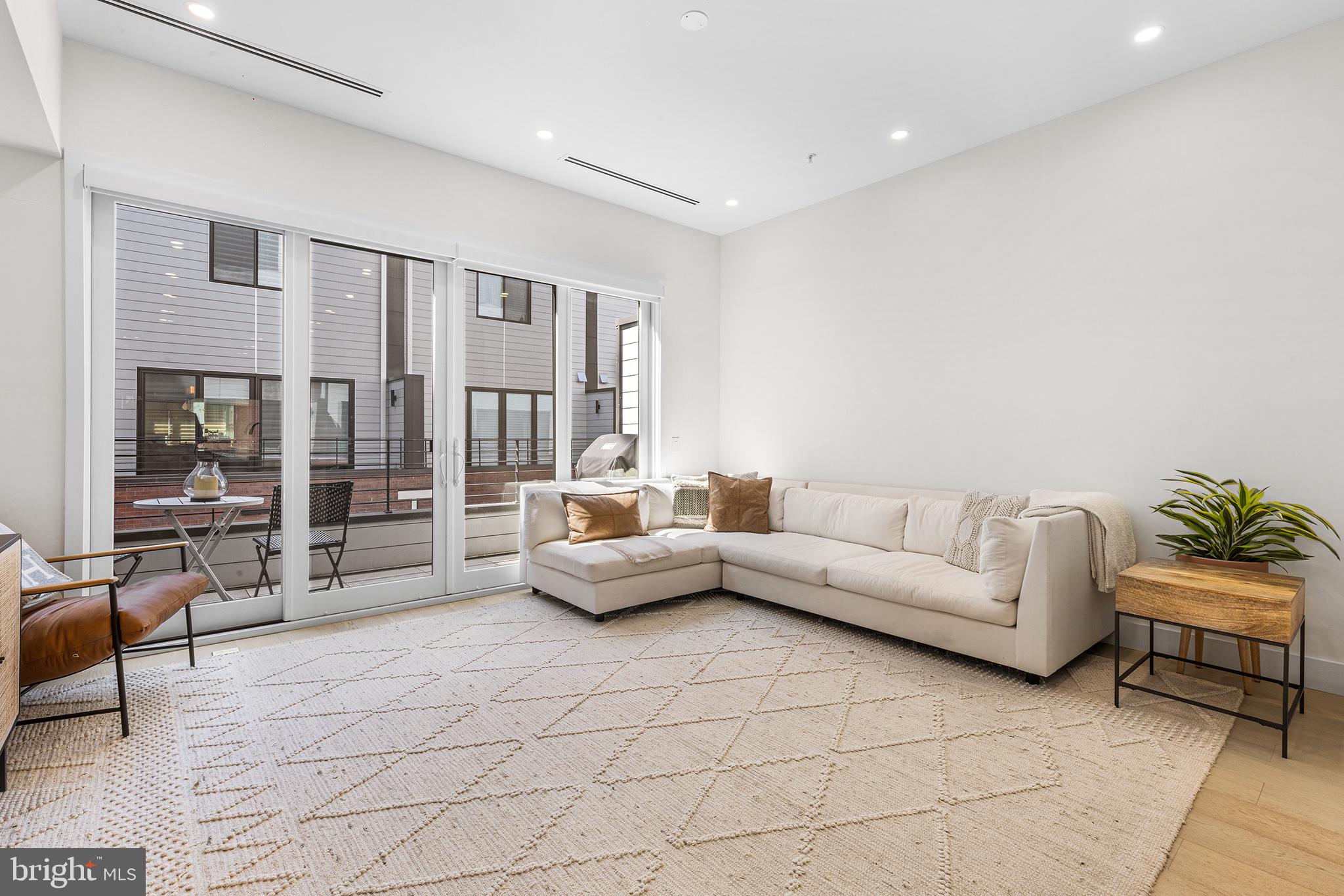116 North Croskey Street Philadelphia, PA 19103 - Photo 14 of 57 a living room with furniture and a large window