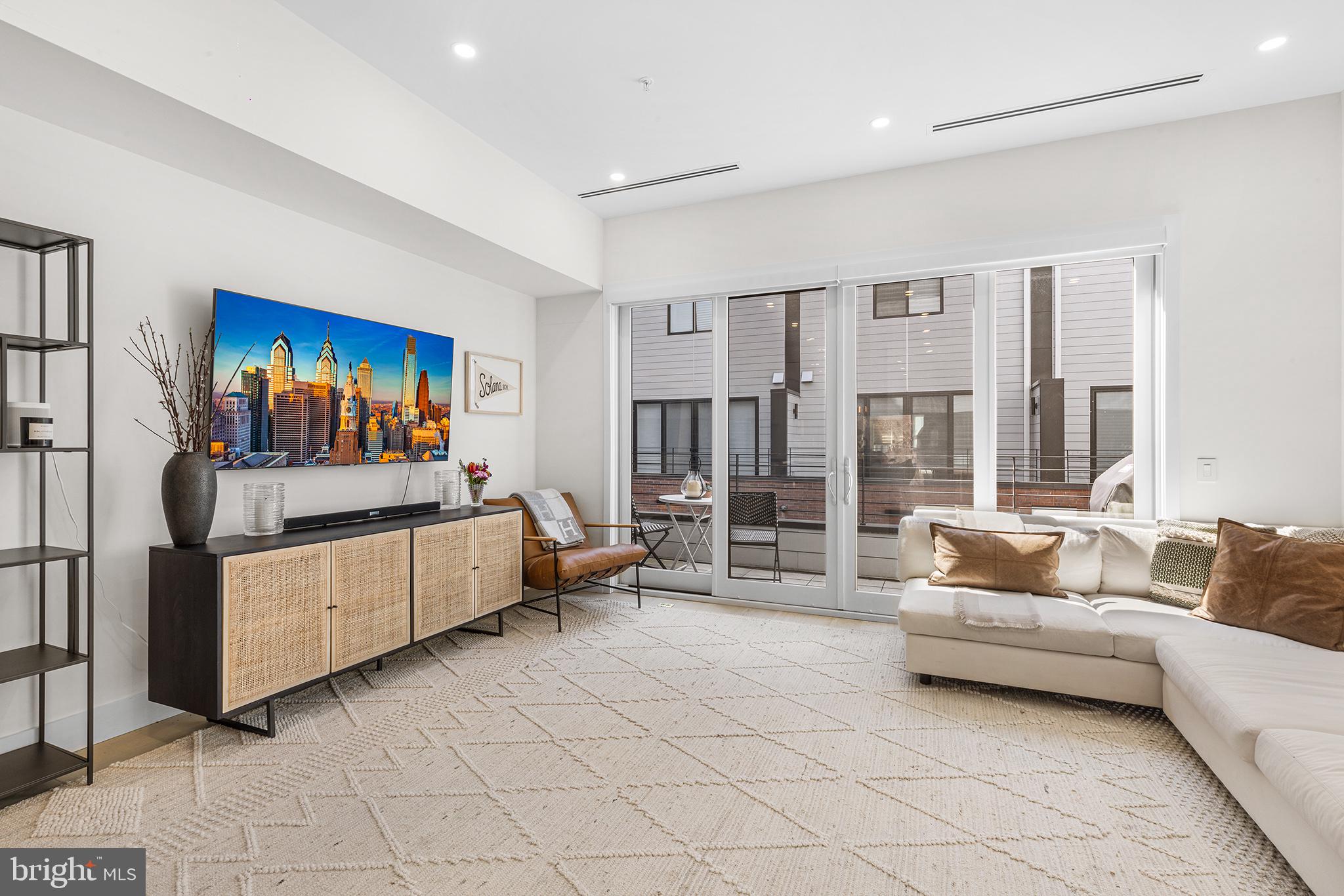 116 North Croskey Street Philadelphia, PA 19103 - Photo 15 of 57 a living room with furniture and a flat screen tv
