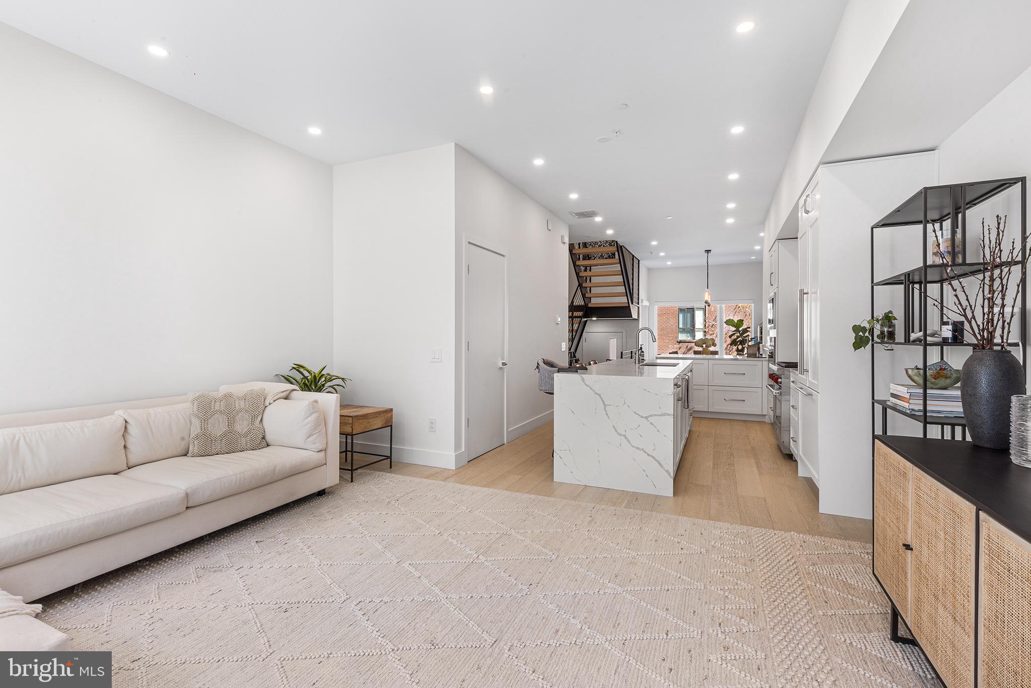 116 North Croskey Street Philadelphia, PA 19103 - Photo 16 of 57 a living room with furniture and a couch