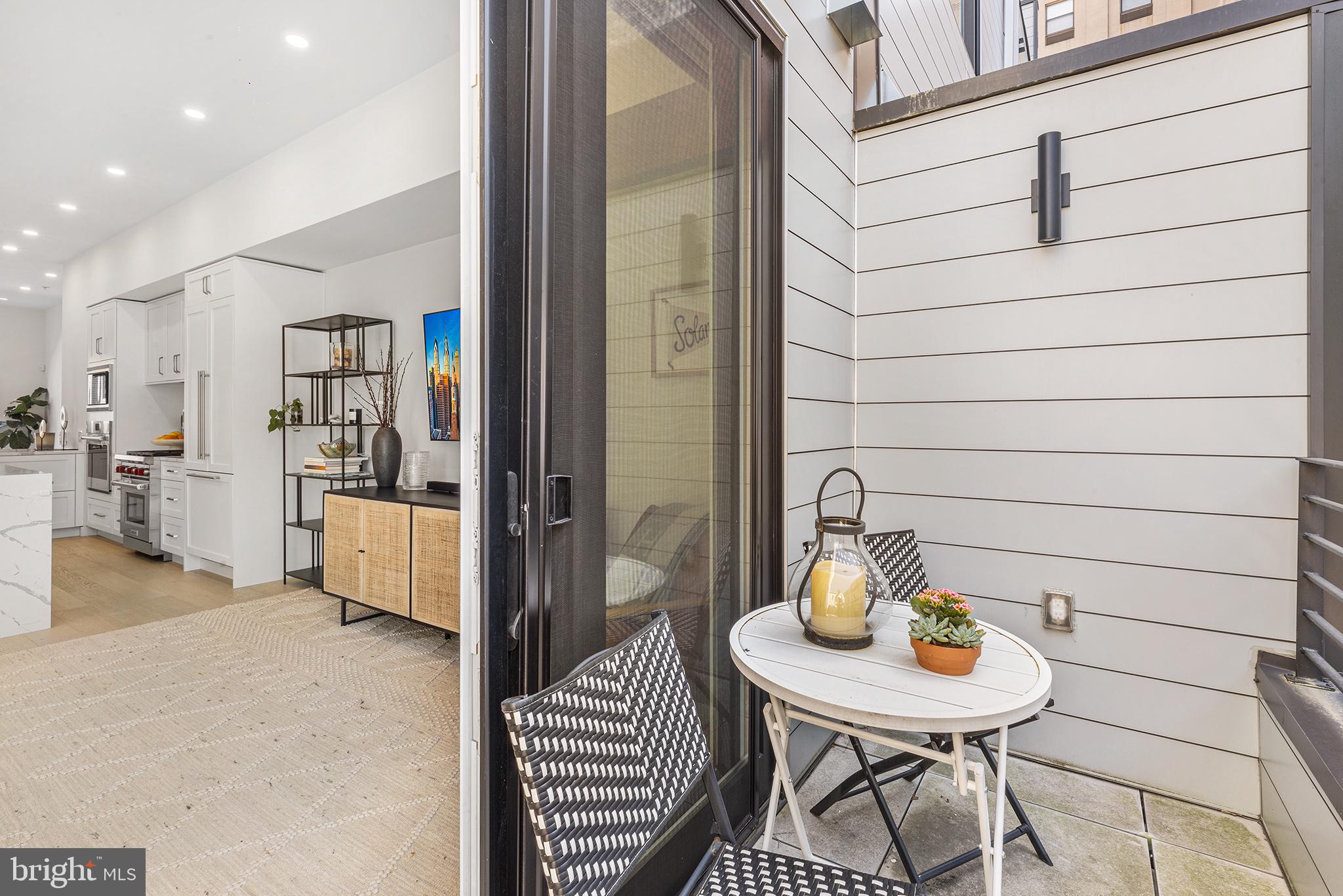 116 North Croskey Street Philadelphia, PA 19103 - Photo 17 of 57 a view of a hallway that has a table and chairs