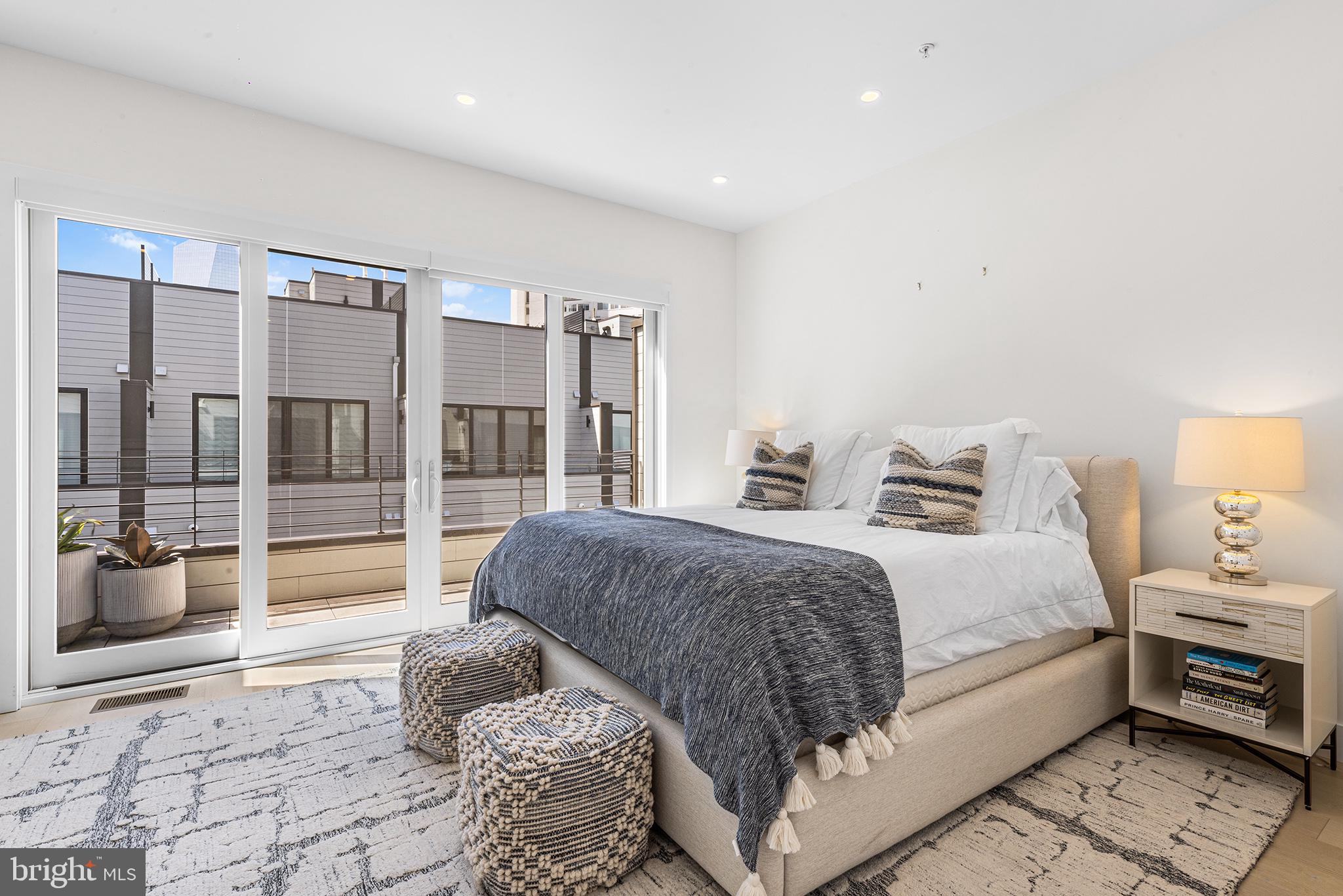 116 North Croskey Street Philadelphia, PA 19103 - Photo 30 of 57 a bedroom with a large bed and a window