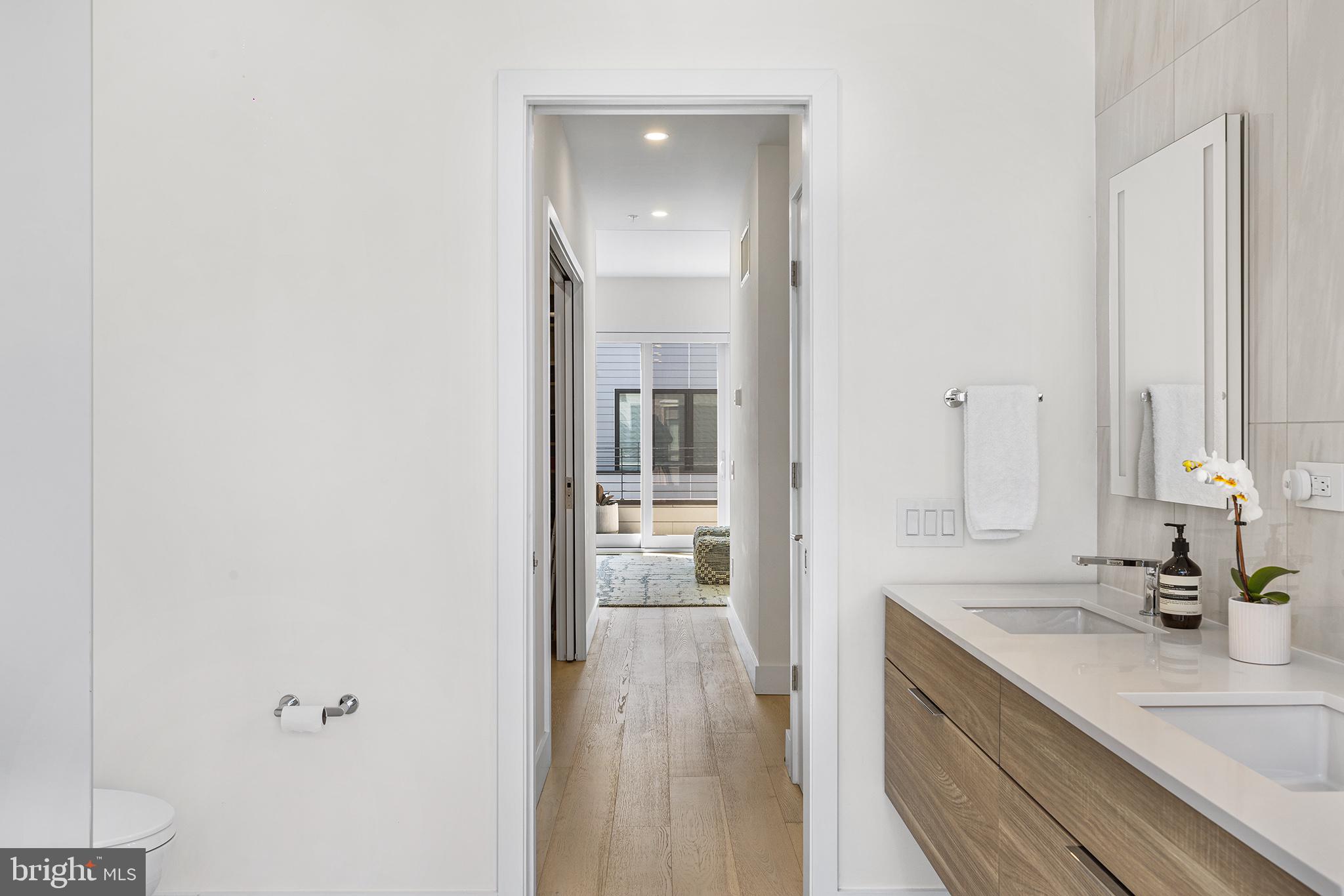 116 North Croskey Street Philadelphia, PA 19103 - Photo 36 of 57 a bathroom with a sink and a mirror