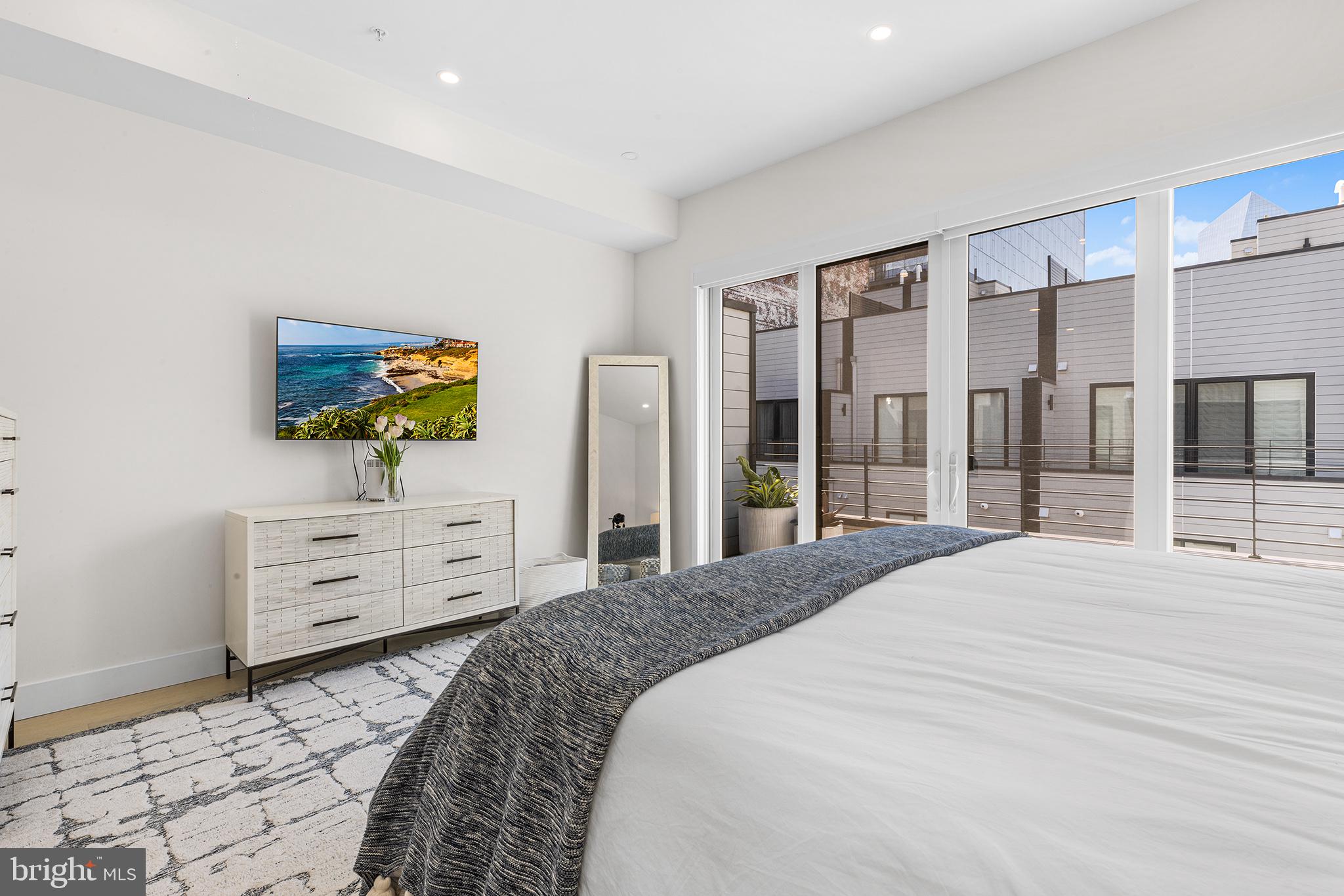 116 North Croskey Street Philadelphia, PA 19103 - Photo 38 of 57 a bedroom with a bed and a dresser