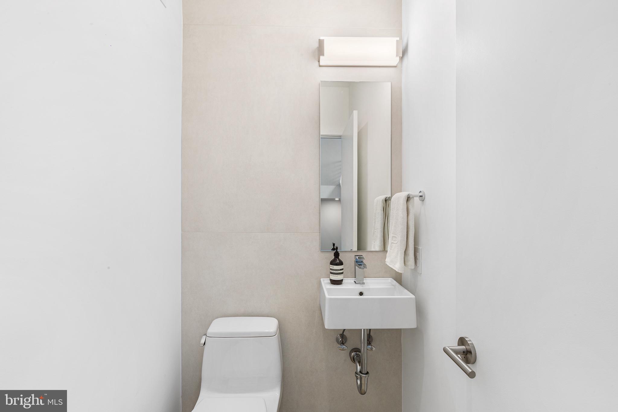 116 North Croskey Street Philadelphia, PA 19103 - Photo 41 of 57 a bathroom with a sink a toilet and mirror