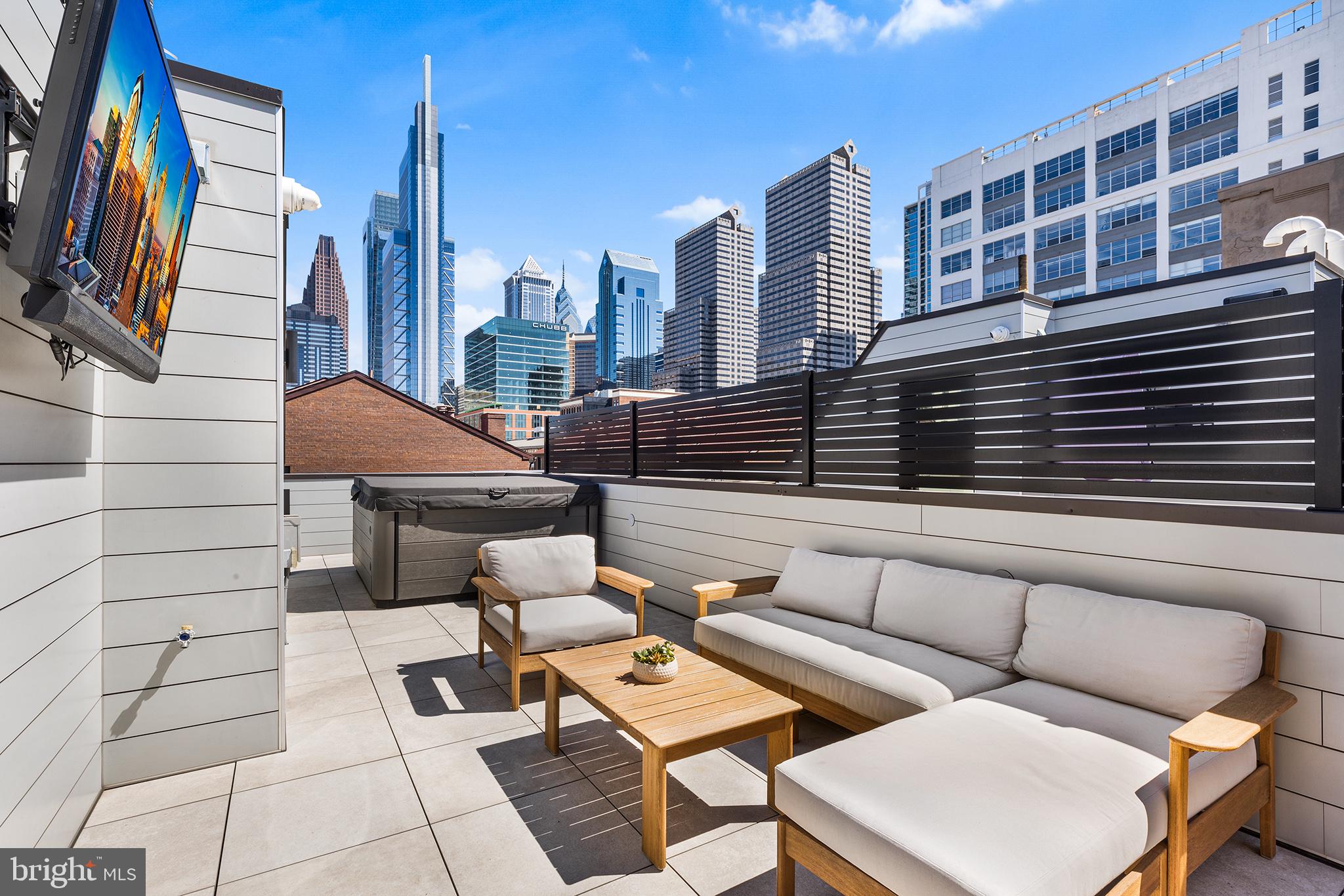 116 North Croskey Street Philadelphia, PA 19103 - Photo 43 of 57 a roof deck with couch and chairs