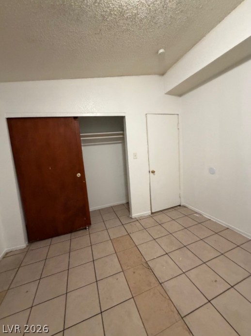 521 North Decatur Boulevard, Unit B Las Vegas, NV 89107 - Photo 16 of 17 Functional bedroom featuring ample storage and easy-to-maintain flooring.