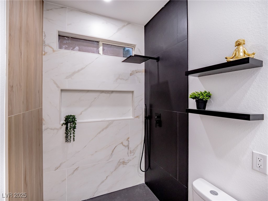 7870 Midnight Ride Street Las Vegas, NV 89131 - Photo 34 of 69 Bathroom featuring a marble finish shower