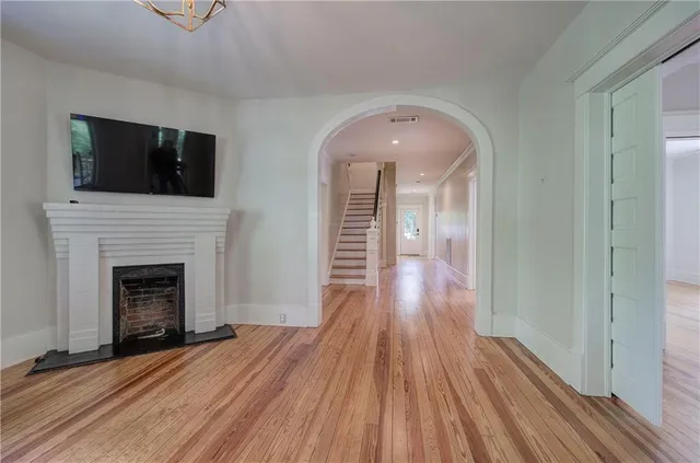 a kitchen with a stove a sink and a window