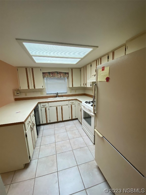 1603 Willow Oak Drive Edgewater, FL 32132 - Photo 12 of 26 a kitchen with stainless steel appliances a refrigerator and a sink