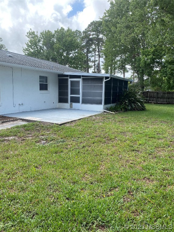 1603 Willow Oak Drive Edgewater, FL 32132 - Photo 7 of 26 a backyard of a house with lots of green space