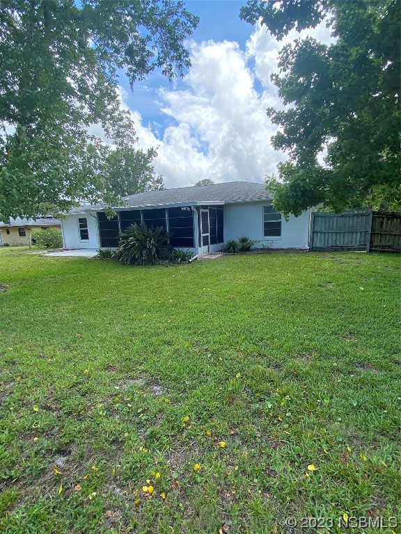 1603 Willow Oak Drive Edgewater, FL 32132 - Photo 8 of 26 a backyard of a house with lots of green space