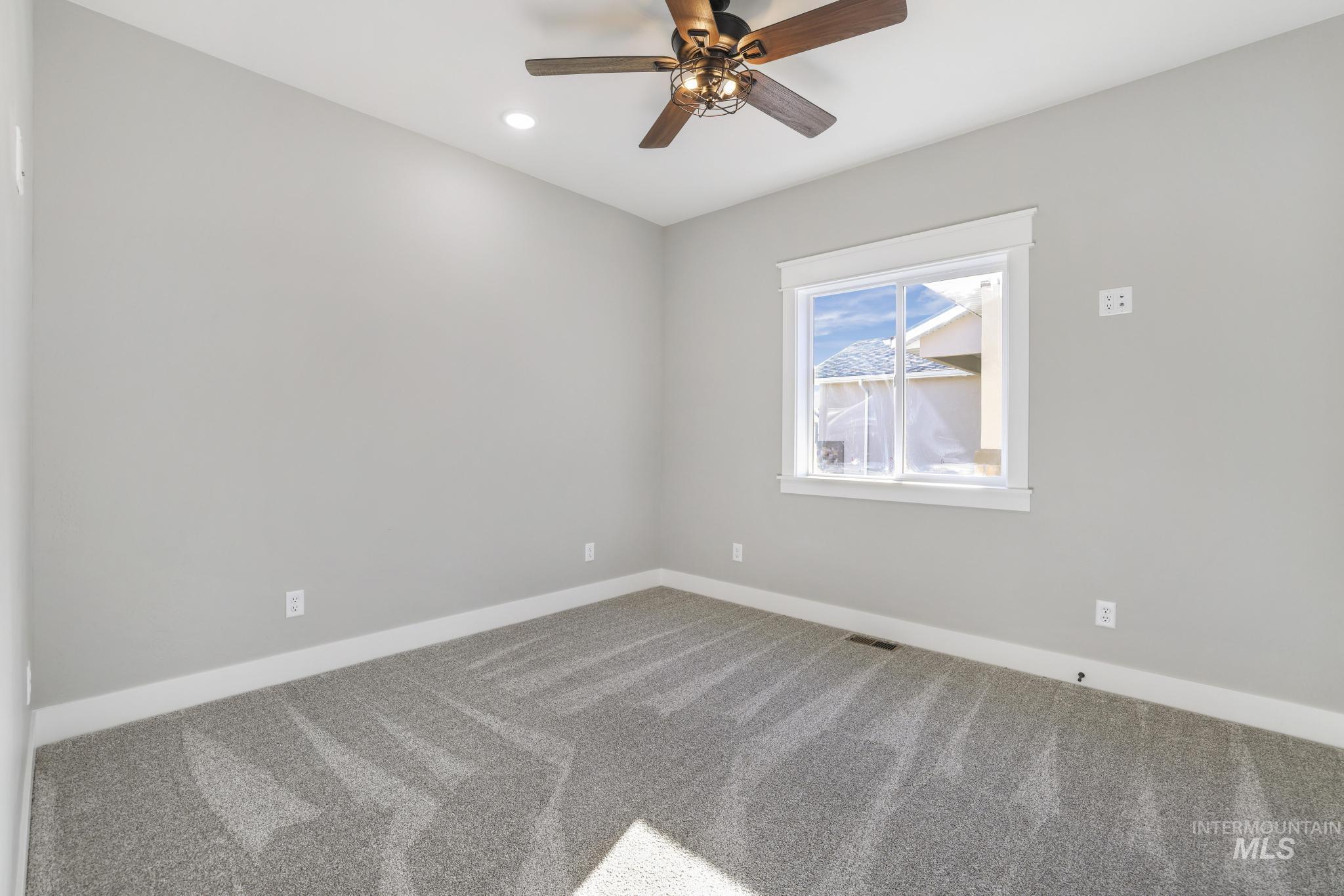 298 Sandi Road Twin Falls, ID 83301 - Photo 23 of 24 Neutral gray carpeting and walls with white trim