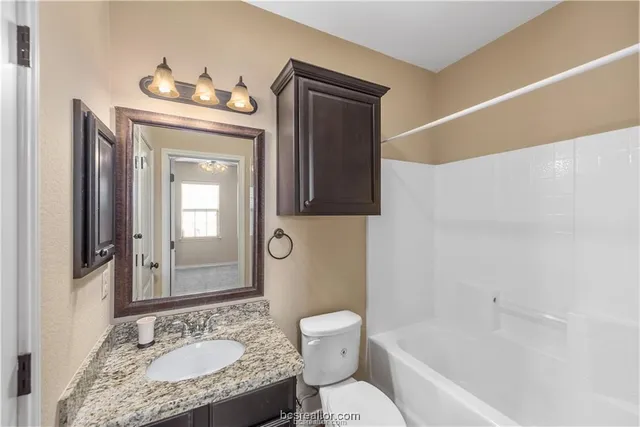 a view of a house with backyard and porch