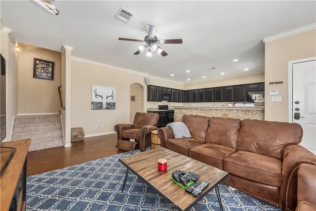 a living room with furniture or couch and a dining table