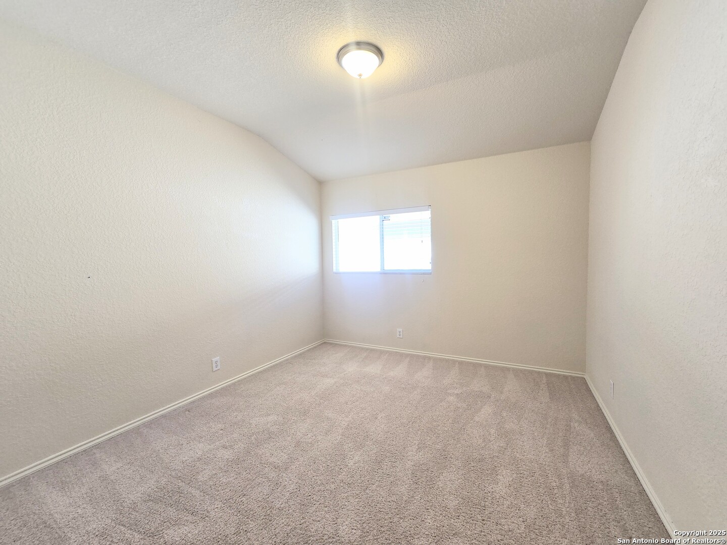 2711 Skybound San Antonio, TX 78245 - Photo 12 of 23 an empty room with windows