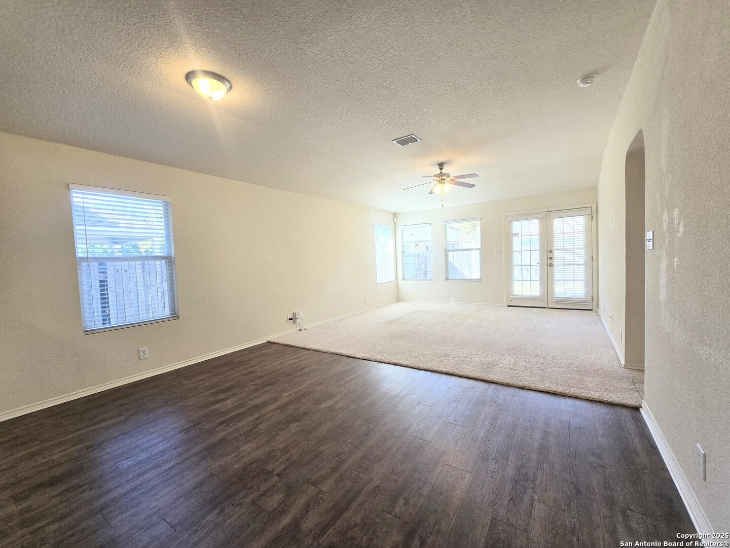 2711 Skybound San Antonio, TX 78245 - Photo 14 of 23 an empty room with wooden floor and windows