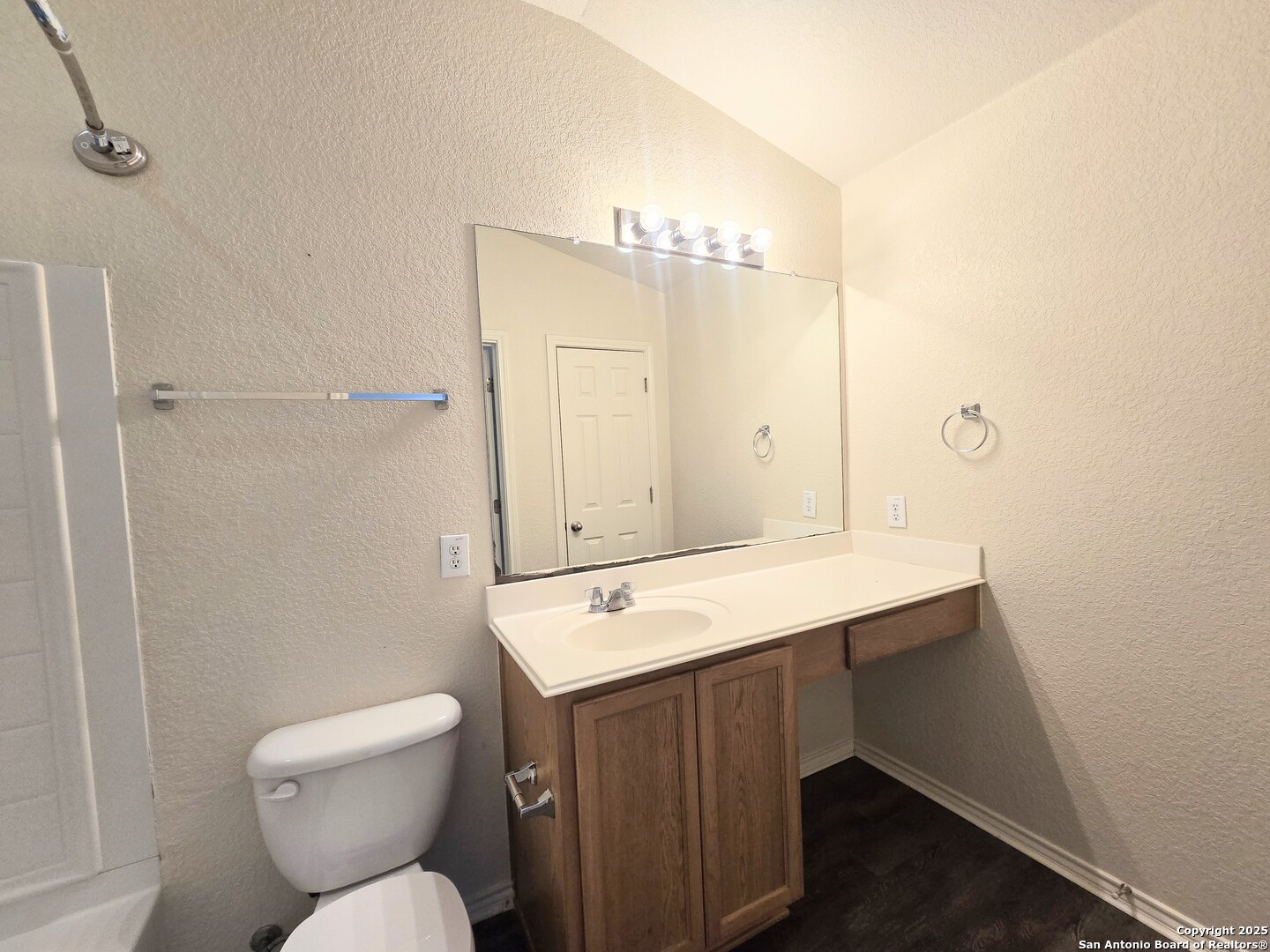 2711 Skybound San Antonio, TX 78245 - Photo 18 of 23 a bathroom with a sink toilet and shower