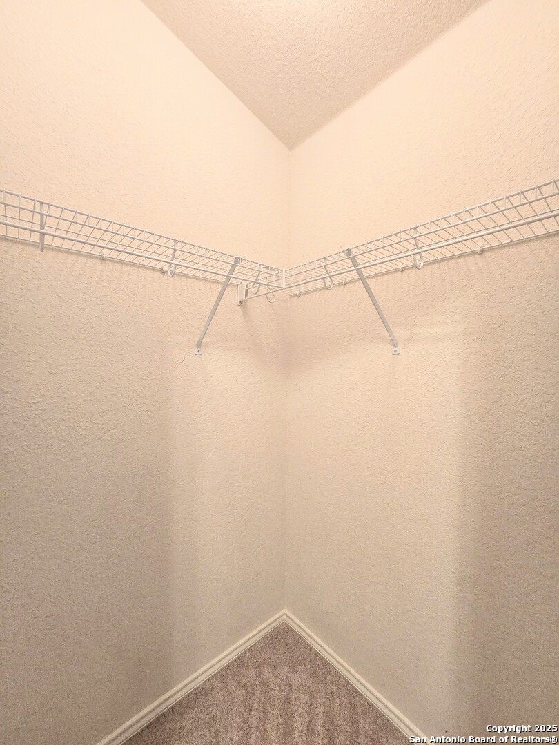 2711 Skybound San Antonio, TX 78245 - Photo 10 of 23 a view of a room with racks on the wall