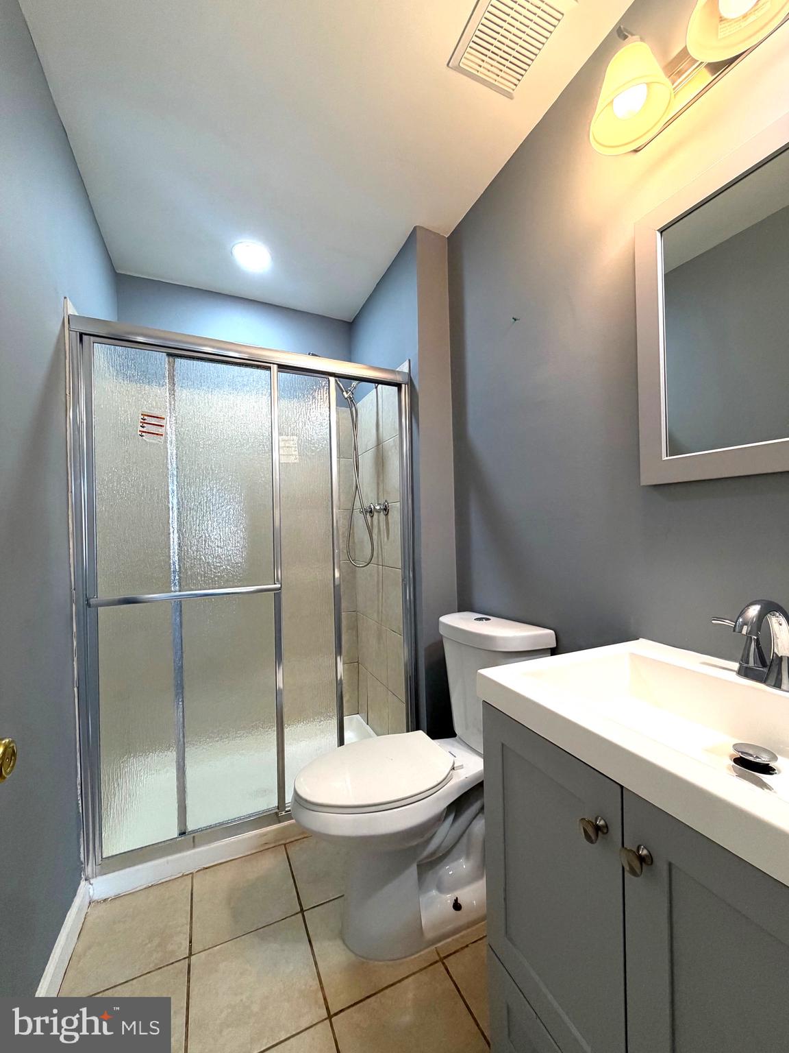 2346 Sun Valley Circle, Unit 2A Silver Spring, MD 20906 - Photo 15 of 21 a bathroom with a toilet sink and shower